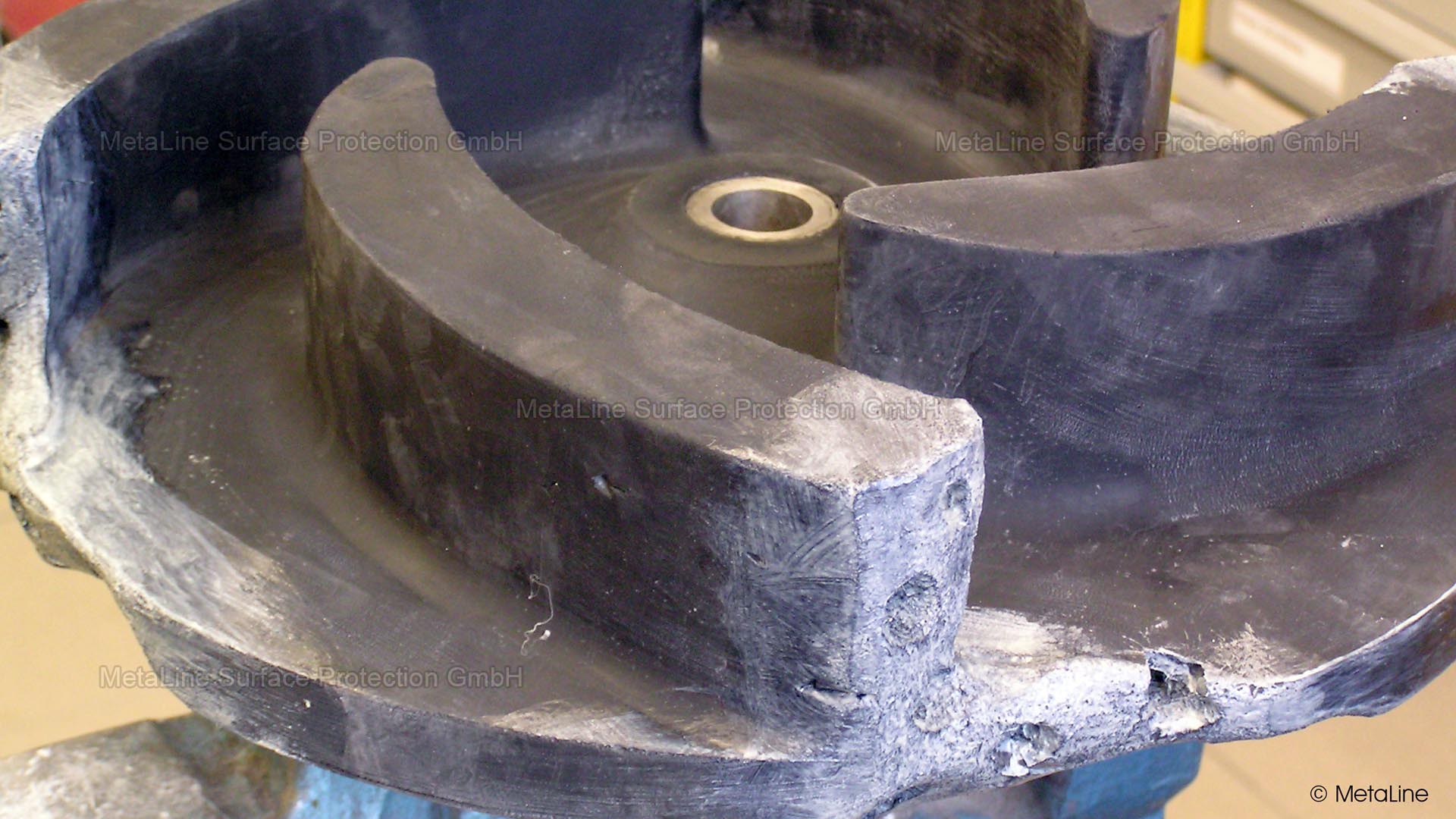Damaged solid rubber pump impeller with broken blade