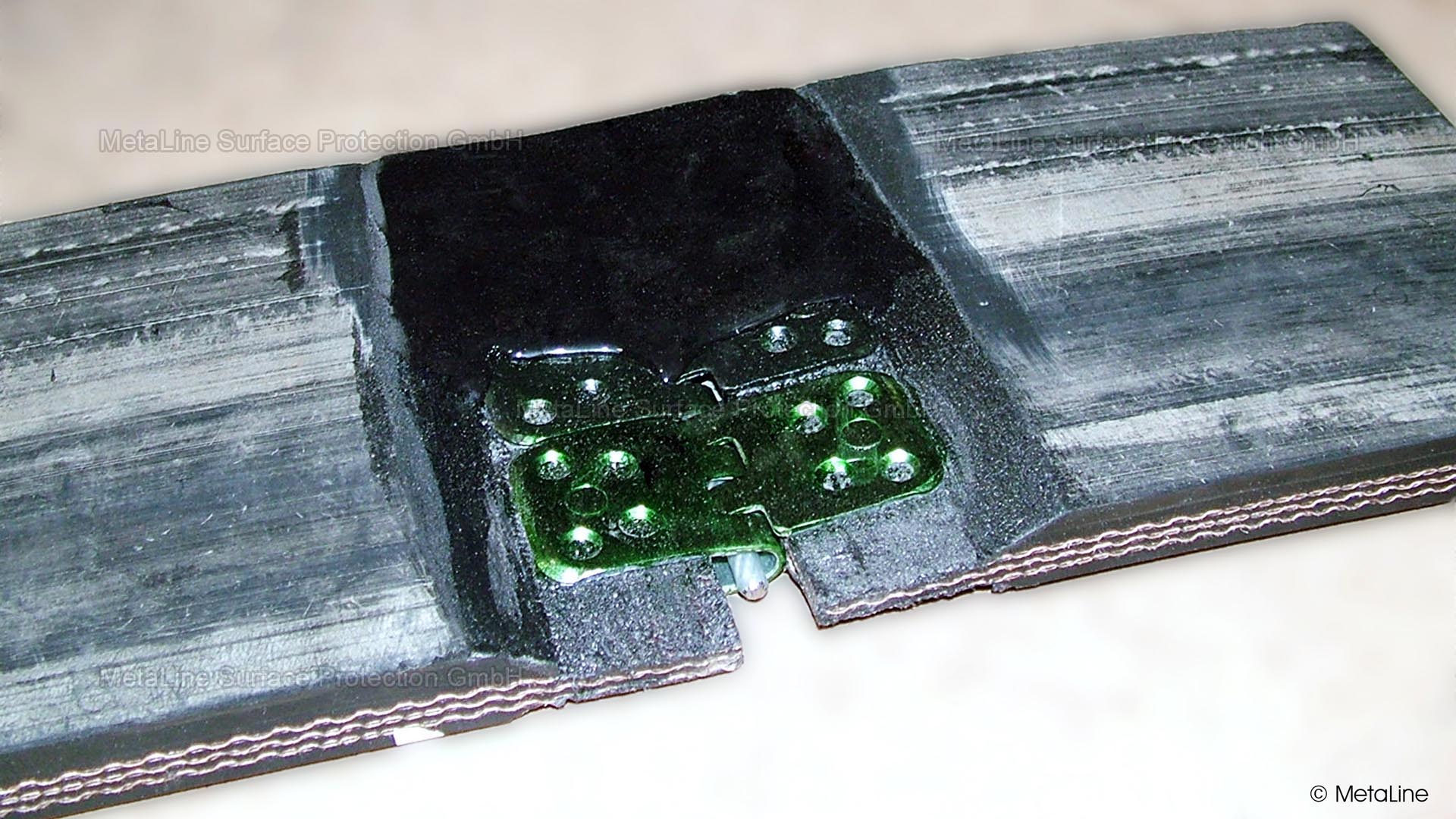 Coating scheme to protect a belt fastener