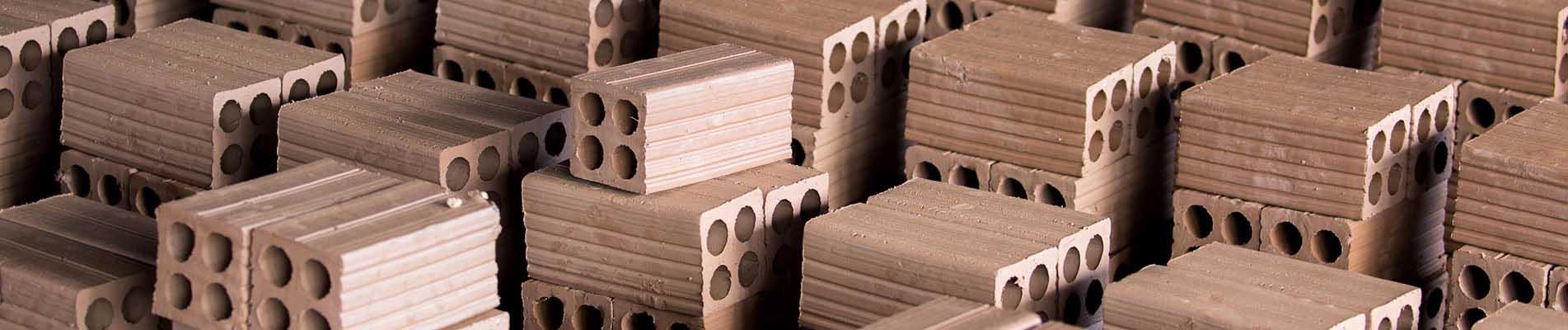 Coatings to minimize wear in ceramic tile manufacturing